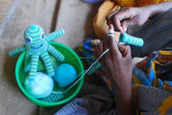 A Global Mothers artisan in Bangladesh knitting an Octopus Rattle A Global Mothers artisan in Bangladesh knitting an Octopus Rattle